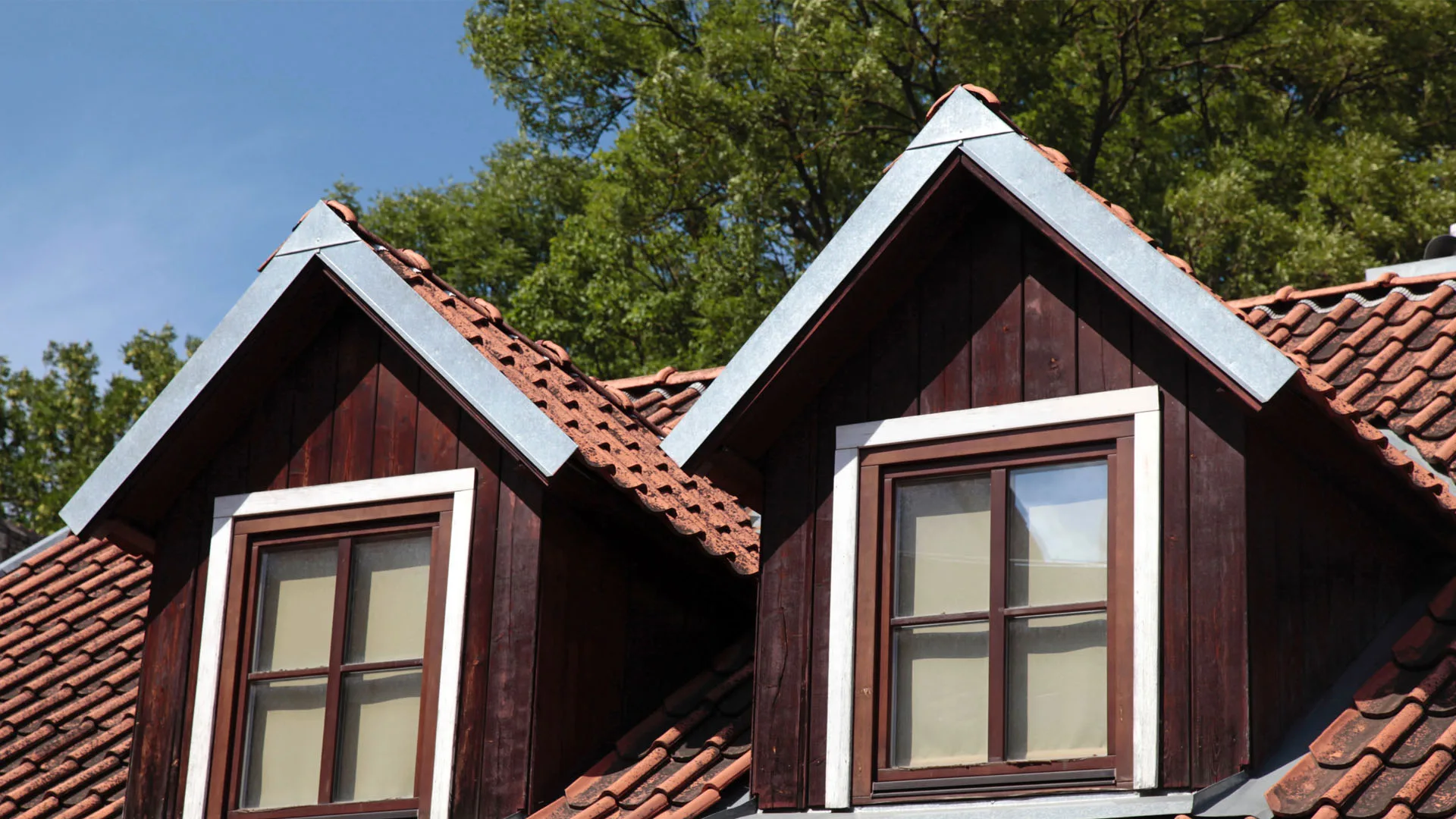 Dormer windows set into a tiled residential roof