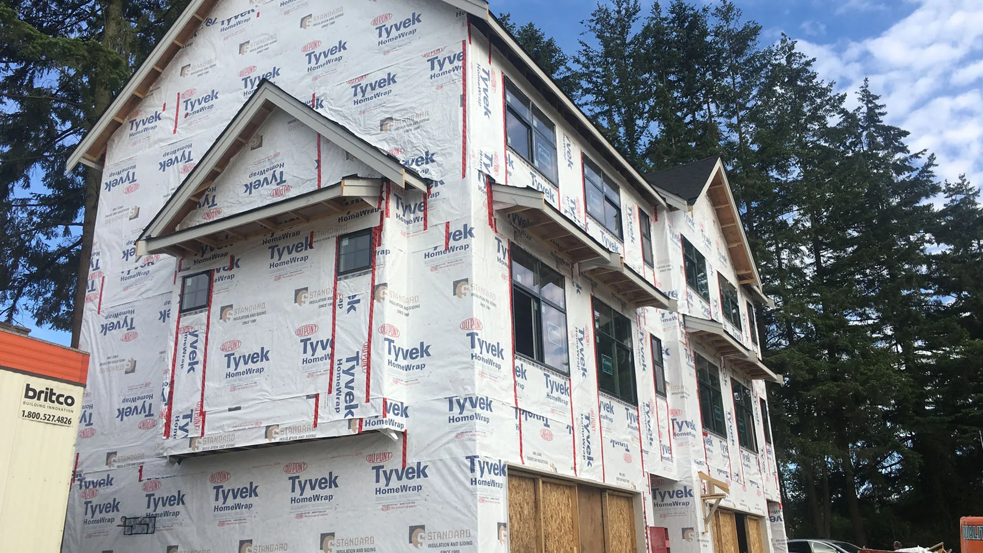 Tyvek HomeWrap installed around windows on a residential exterior before cladding