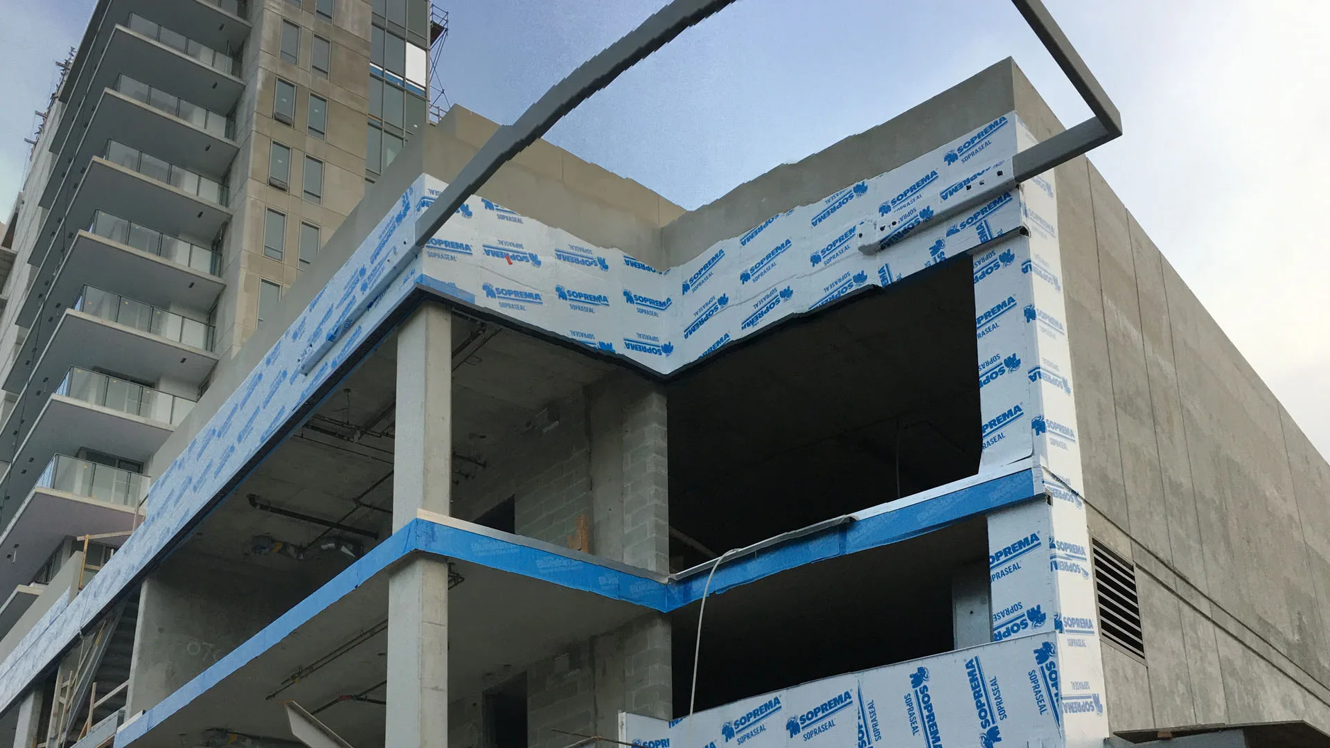 Weather barrier and flashing around a residential building opening